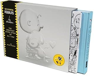 A book cover of The Essential Peanuts by Charles M. Schulz: The Greatest Comic Strip of All Time